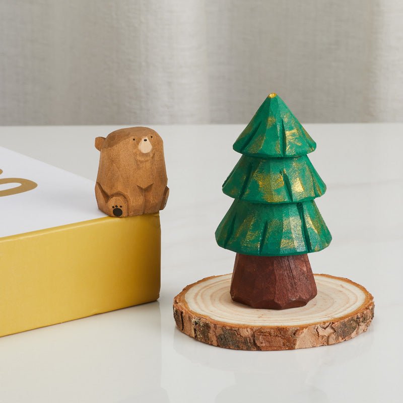 Wooden tree and bear figurine set displayed on table