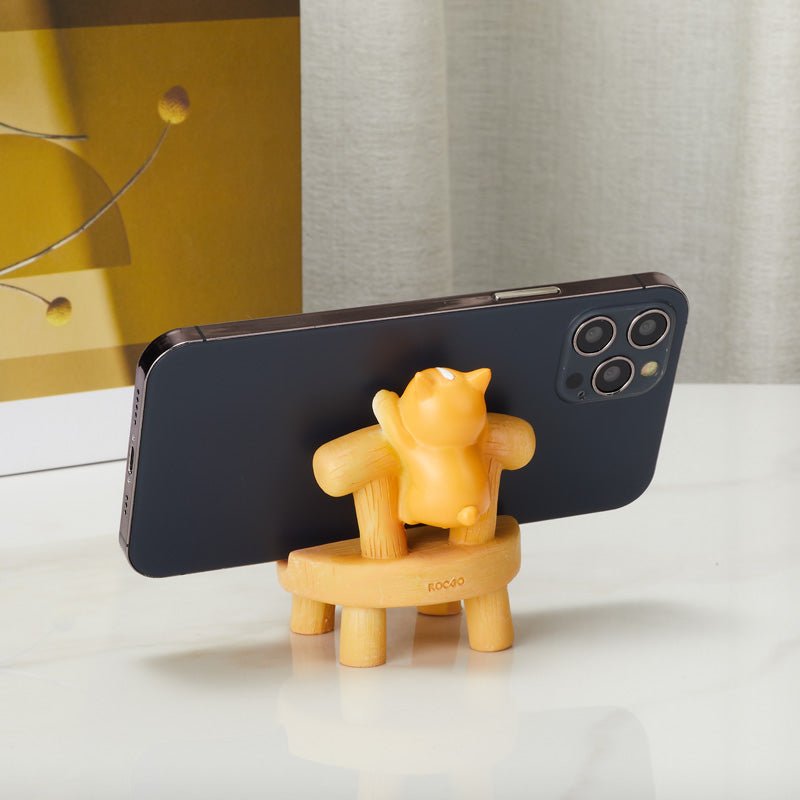 Cat on chair phone holder supporting a smartphone from the back