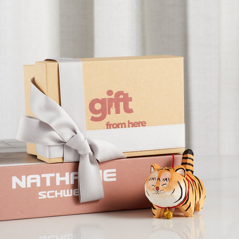 Handcrafted wooden tiger figurine with a red collar and bell gift set