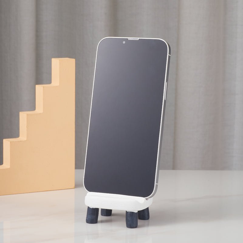 Panda-shaped phone holder displaying a smartphone, front view