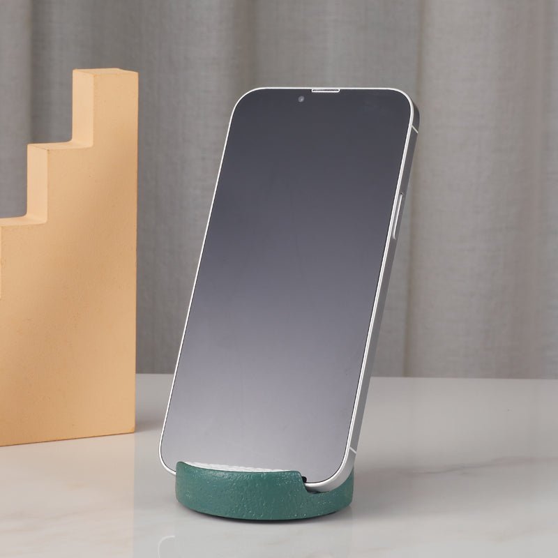 Phone standing upright in the cat-themed phone holder