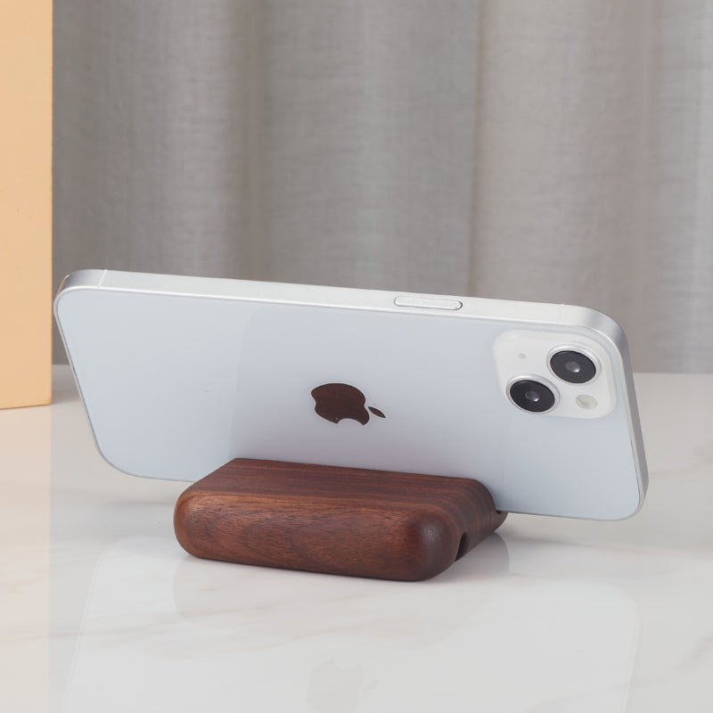 Wooden phone stand holder displaying a smartphone horizontally (back view)