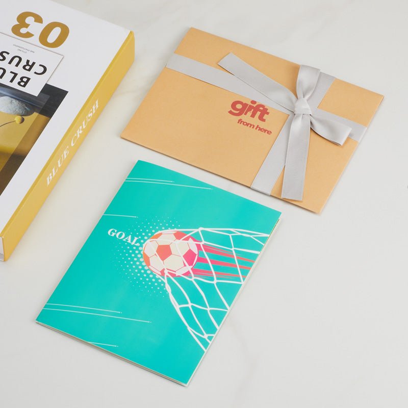 3D Pop-Up Soccer Greeting Card with a teal cover featuring a soccer ball and goal illustration, alongside gift packaging