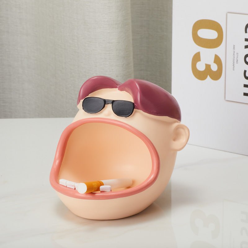 Side view of Funny Big Mouth Dude Ashtray holding cigarettes