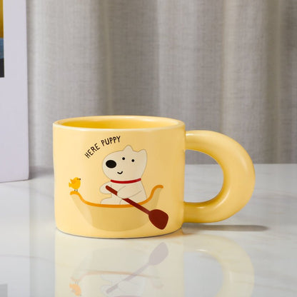 Front view of the cute puppy and bird cartoon mug with unique handle