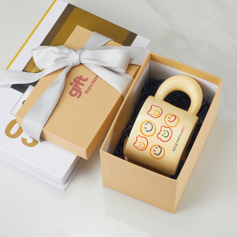 Cheerful bear faces mug in a gift box with a ribbon