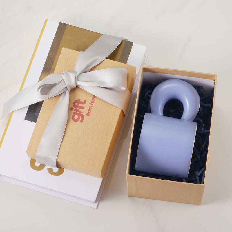 Light blue ceramic mug with a unique handle in a gift box