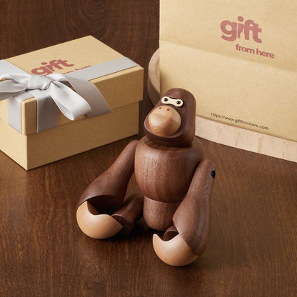 Wooden gorilla figurine with a gift box packaging